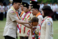 Presiden saat menghadiri Upacara Peringatan Hari Pramuka ke-57, di Lapangan Gajahmada, Taman Rekreasi Wiladatika, Cibubur, Jakarta, Selasa (14/8). (Foto: Humas/Rahmat).