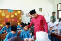 Uji Coba Makan Bergizi Gratis (MBG) di SDN 007 Panggak Darat | f. Diskominfo Lingga